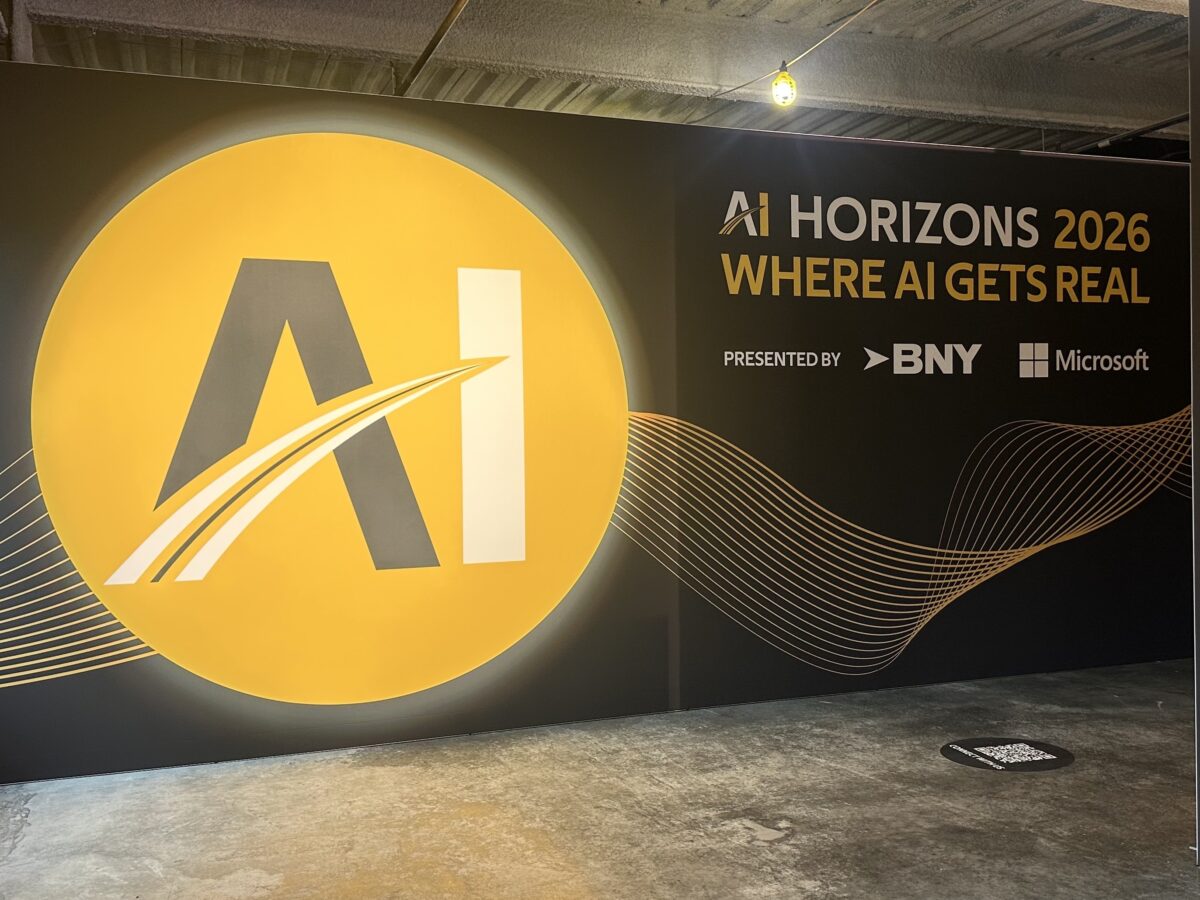 Sign for the AI Horizons 2026 conference, presented by BNY and Microsoft, featuring a large yellow circular logo with “AI” text.